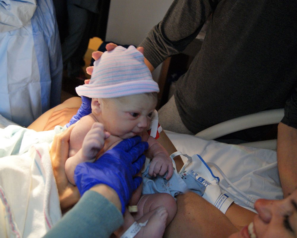 Newborn gazing at Mother newborn gazing into their mother's face