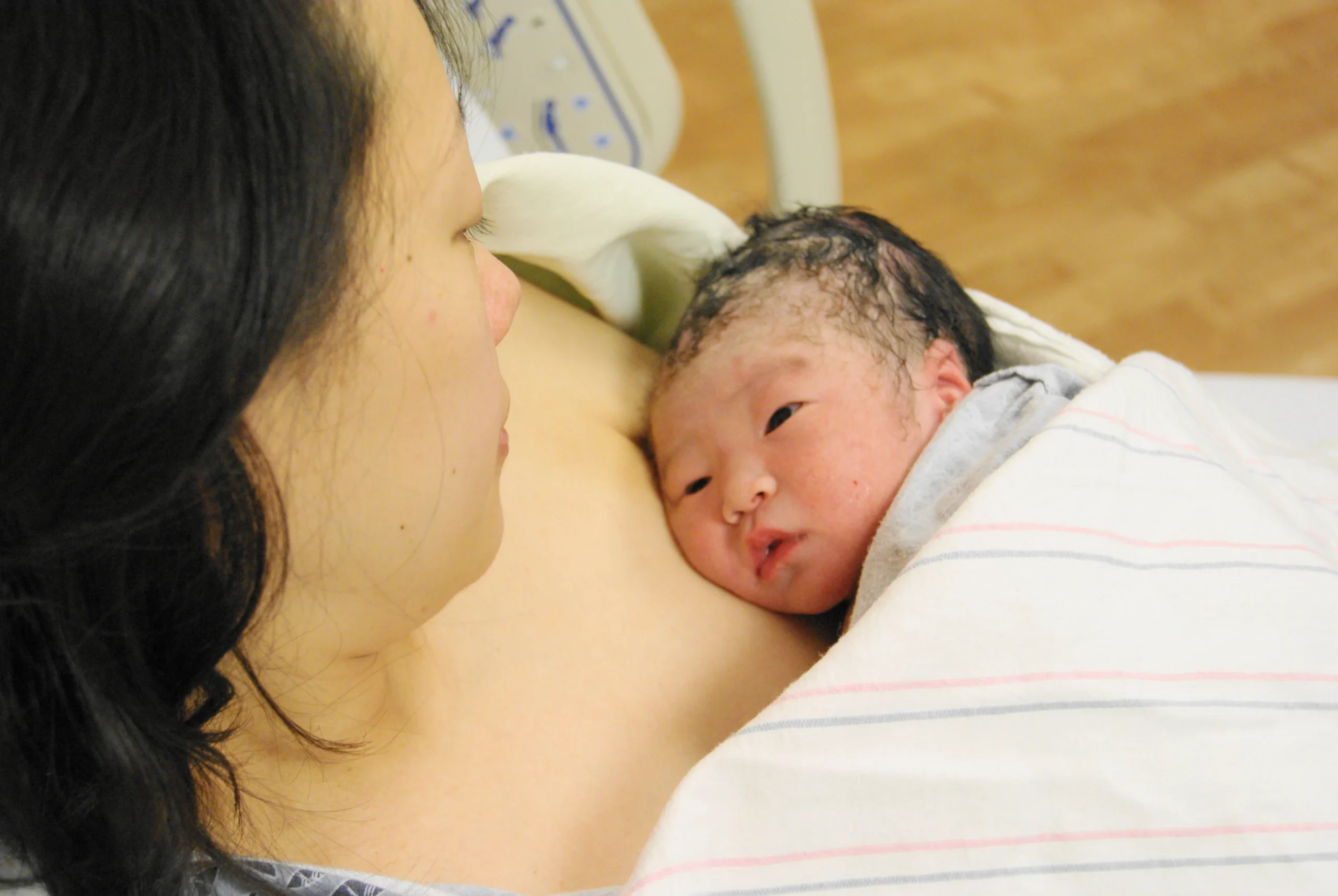 Newborn baby on mother's chest