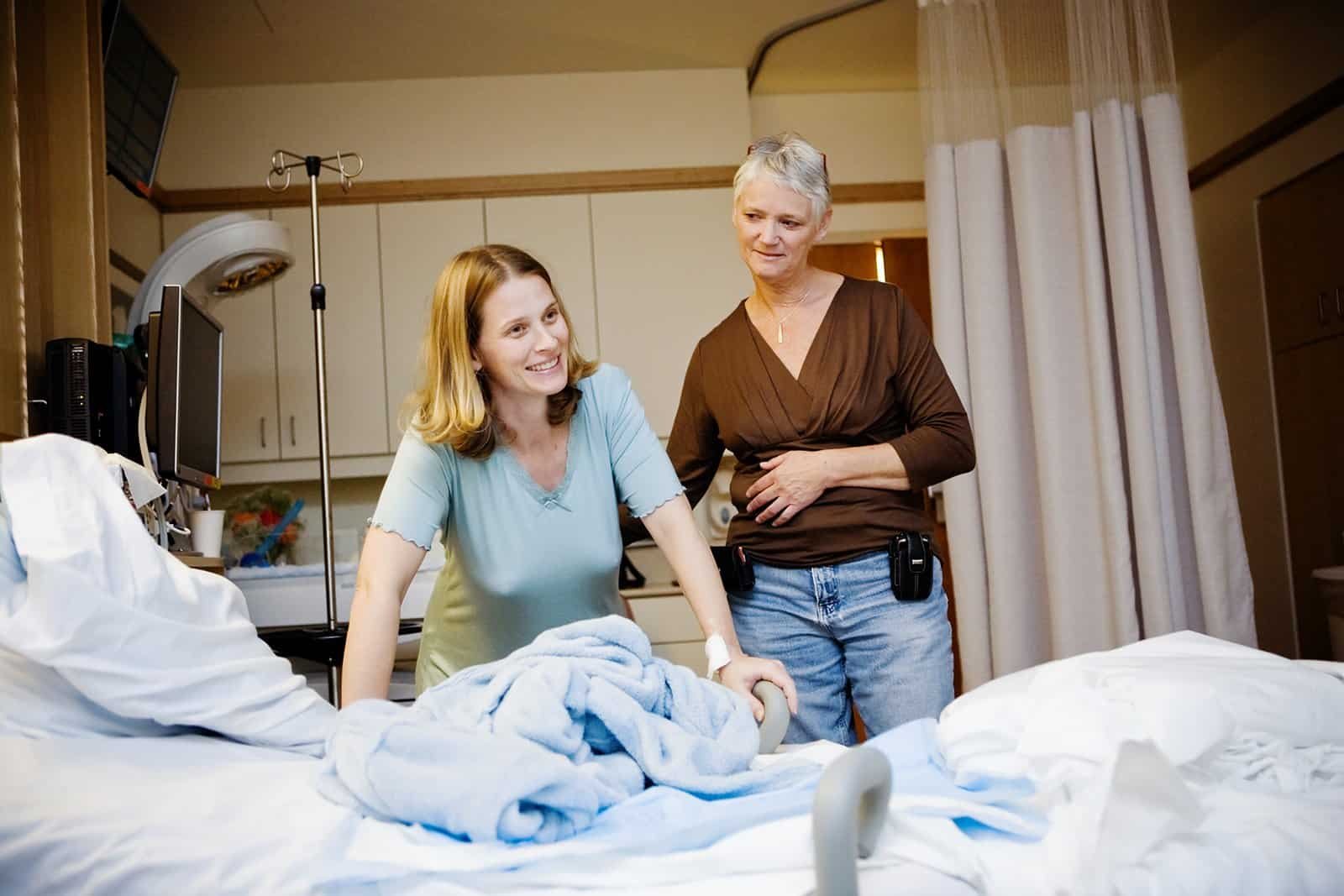 A happy moment between contractions at a hospital birth with a doula.